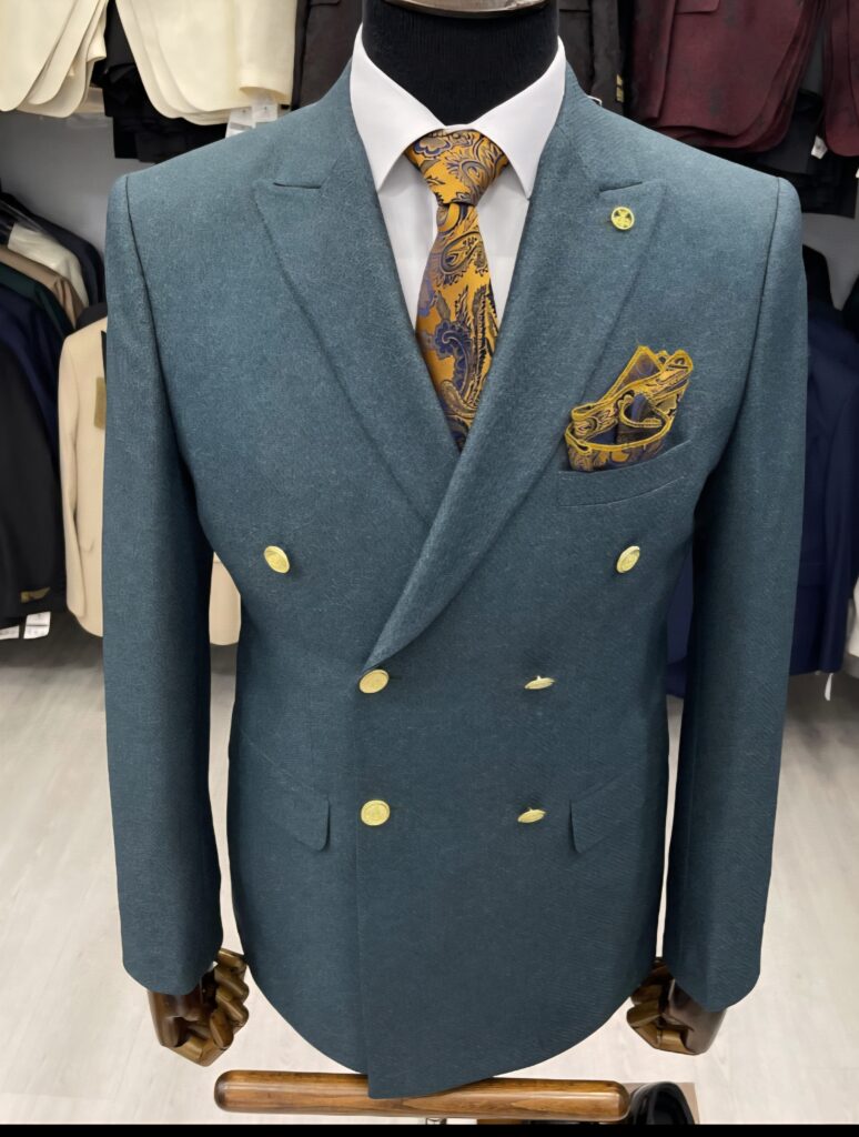Teal blue blazer with golden buttons